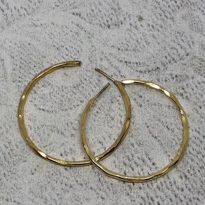 Vintage, signed, gold over sterling silver textured statement hoop earrings.